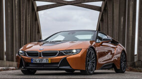 A golden brown BMW on a bridge